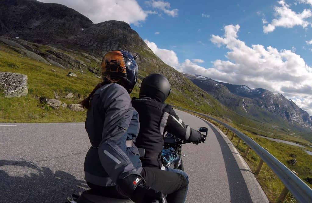 Us in Norway- one of the BEST motorcycling destinations we've been (so far!) We don't often ride 2-up anymore, but the views required extra hands for videoing!!