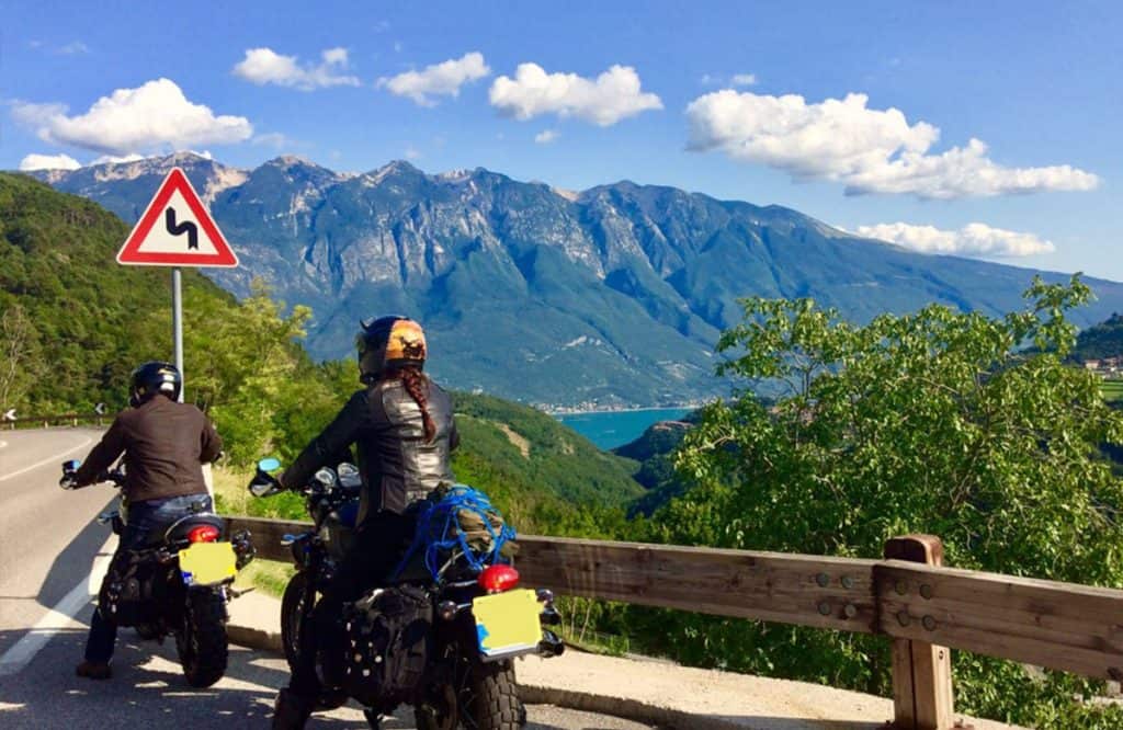 Female motorcycle rider in Italy with husband